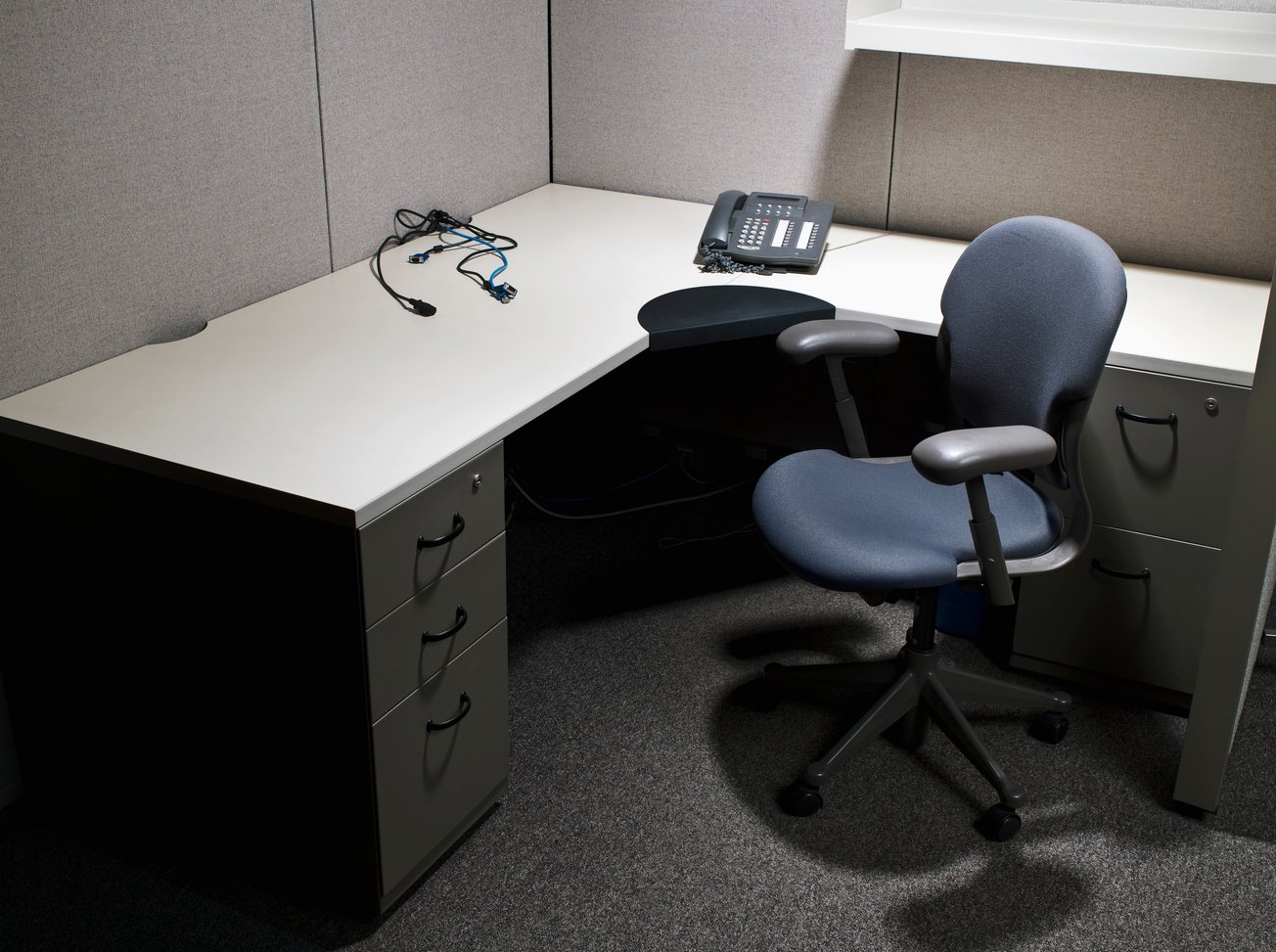 Empty cubicle desk in office