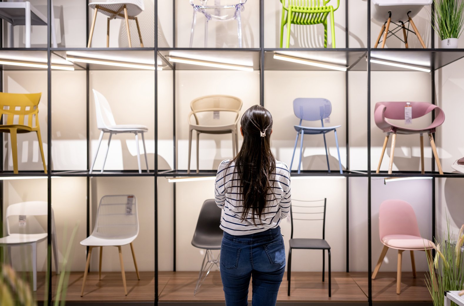 Woman buying chairs at a furniture store